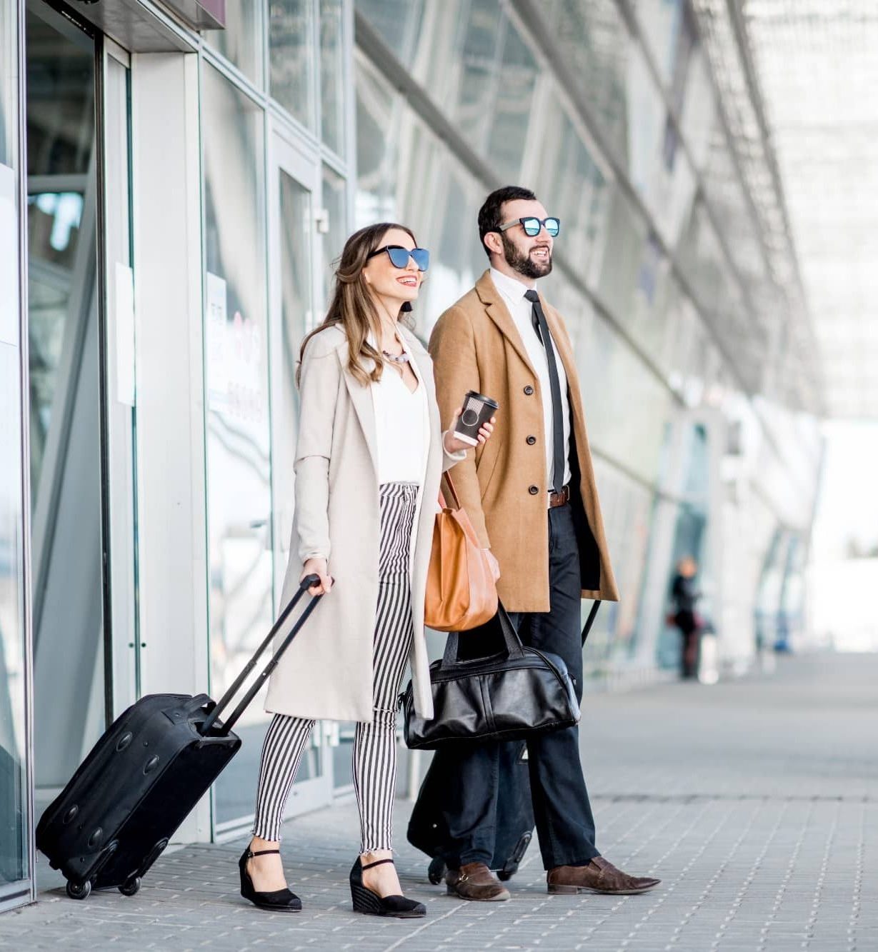 business couple leaving the airport 2021 12 13 22 45 58 utc e1656933710938